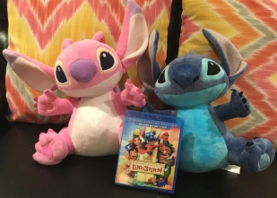 Disney's Lilo & Stitch Movie cover, Plush Stitch and Plush Angel sitting on a couch.