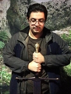 Author Leo A holding a sword